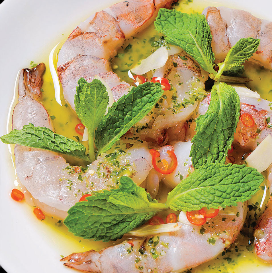 Shrimp and Thai chili dish with fresh herbs by Fish Cheeks