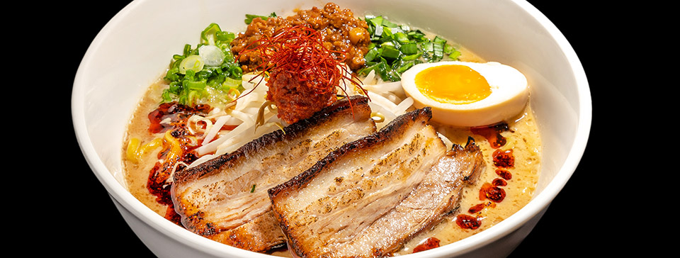 Bowl of pork belly ramen with an egg by Mr Taka