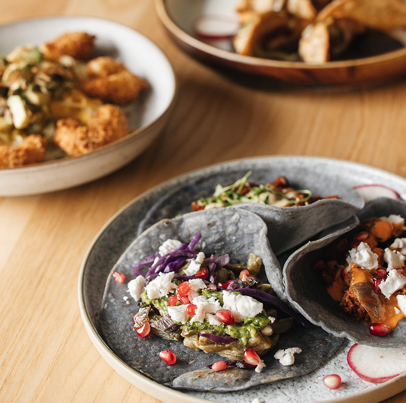 Tacos Al Pastor with oyster mushrooms marinated with achiote and mexican chilies, pineapple, coriander, red onions, and aioli ancho chili salsa.